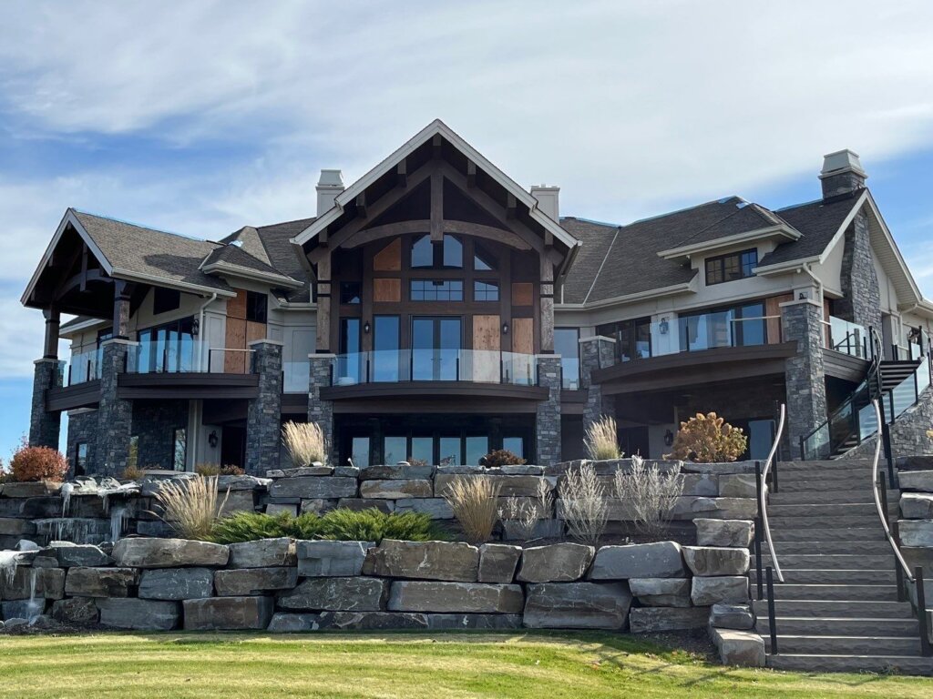 Boulder Creek Construction Roofing and Siding Experts work on large home.